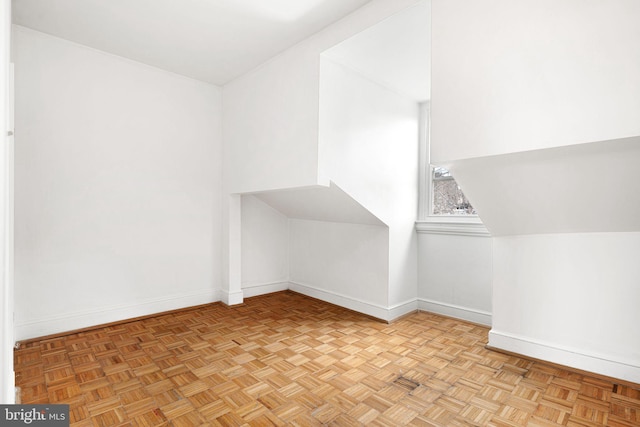 additional living space with light parquet floors