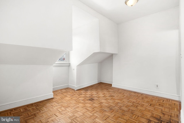 bonus room featuring light parquet floors