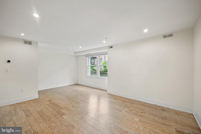 spare room with light wood-type flooring