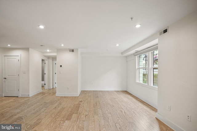 empty room with light hardwood / wood-style floors