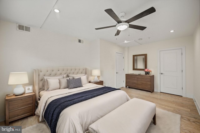 bedroom with ceiling fan and light hardwood / wood-style floors