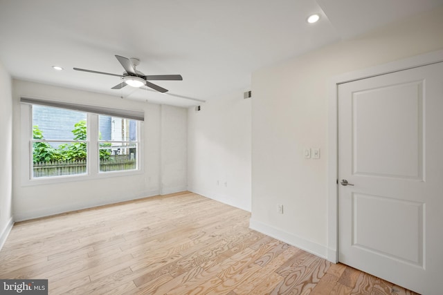 unfurnished room with light hardwood / wood-style flooring and ceiling fan