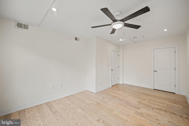 unfurnished room with ceiling fan and light hardwood / wood-style floors