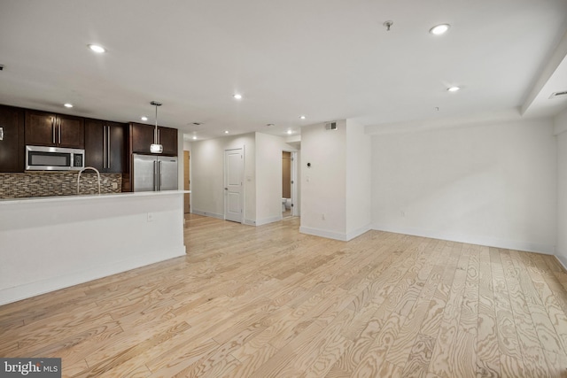 unfurnished living room featuring light wood-type flooring