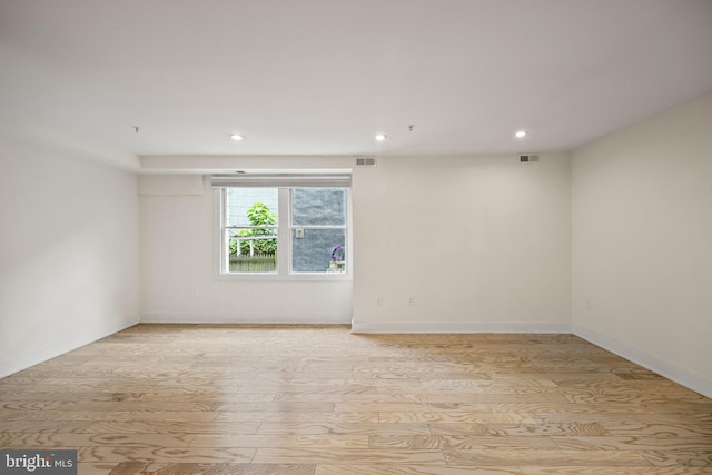 unfurnished room featuring light hardwood / wood-style flooring