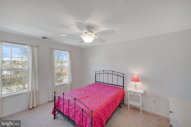 bedroom with ceiling fan and light colored carpet