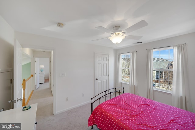 bedroom with light colored carpet and ceiling fan