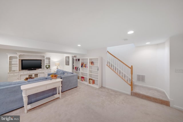 living room featuring light colored carpet