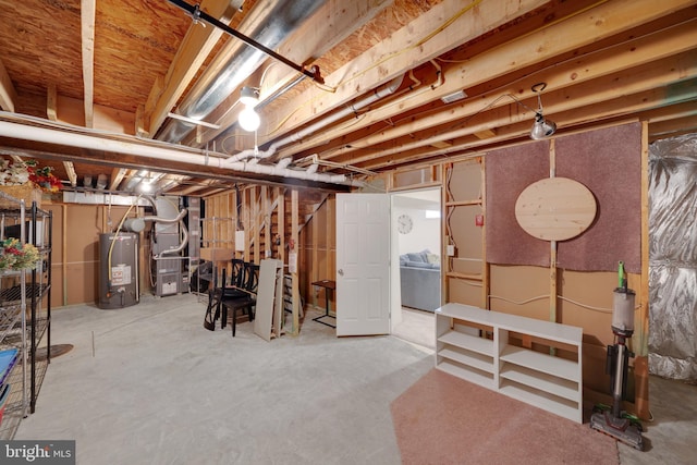 basement with gas water heater and heating unit