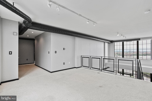 bonus room featuring carpet and baseboards