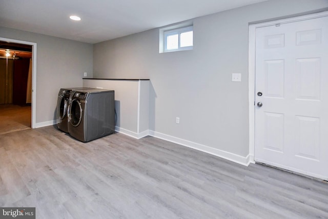 laundry room featuring baseboards, wood finished floors, laundry area, recessed lighting, and washing machine and dryer