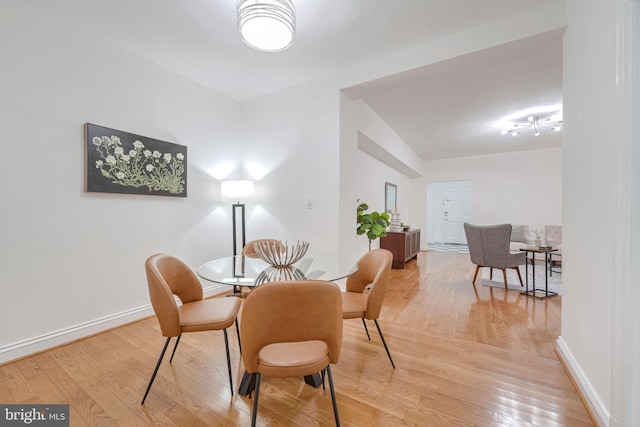 dining area with wood-type flooring