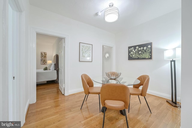 dining space featuring light hardwood / wood-style flooring