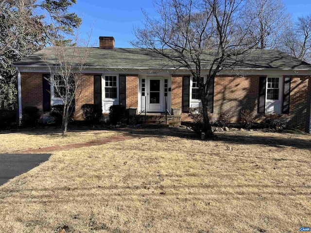 ranch-style house with a front lawn