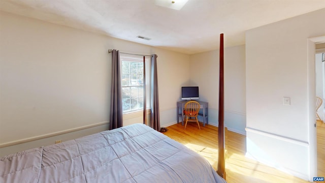 bedroom with light hardwood / wood-style flooring