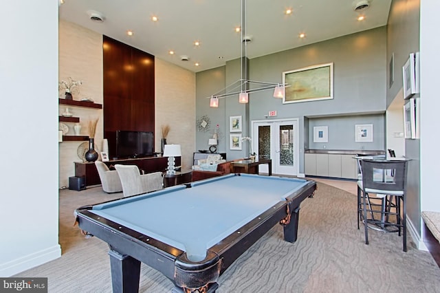 recreation room featuring recessed lighting, a towering ceiling, and billiards