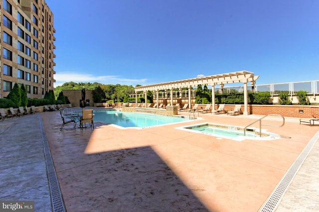 community pool with a patio area, a community hot tub, and a pergola