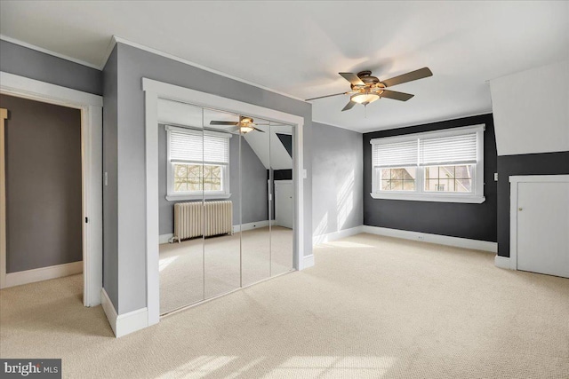 bonus room with light carpet, radiator heating unit, ceiling fan, and vaulted ceiling