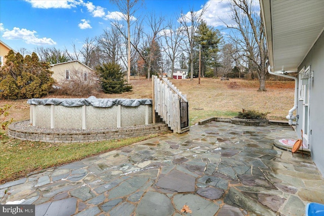 view of patio featuring a covered pool