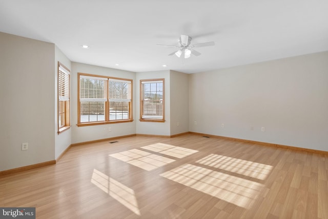 unfurnished room featuring ceiling fan and light hardwood / wood-style floors