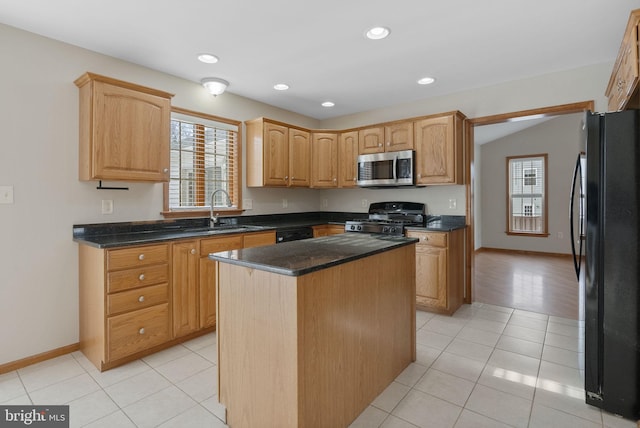 kitchen with vaulted ceiling, a kitchen island, sink, light tile patterned floors, and black appliances