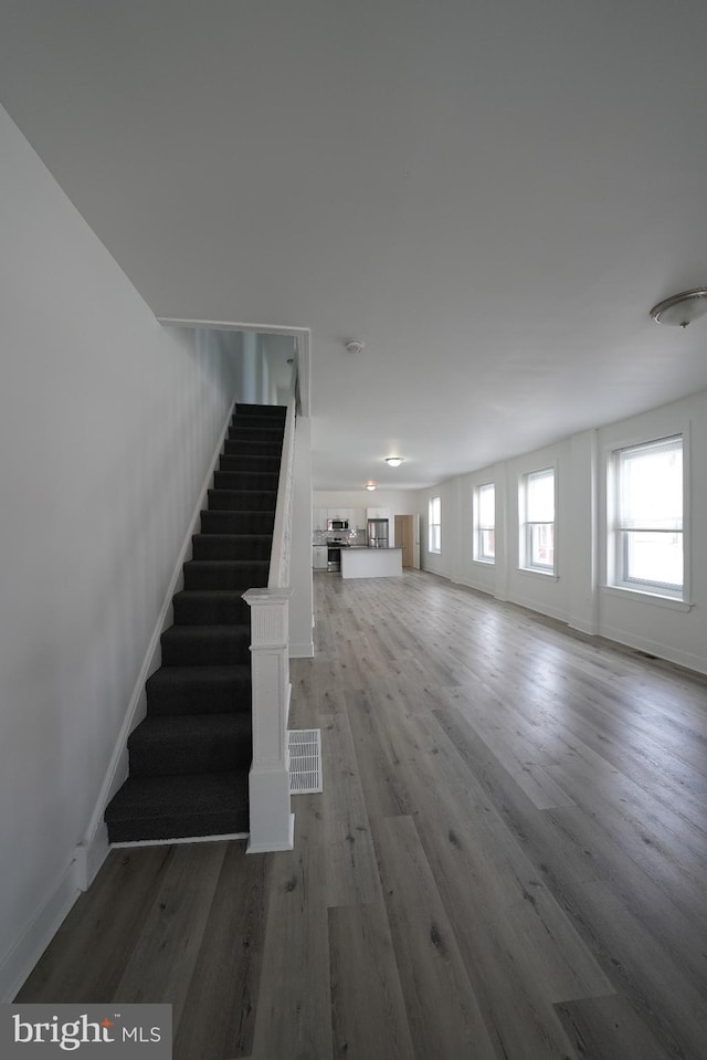 stairway with wood-type flooring