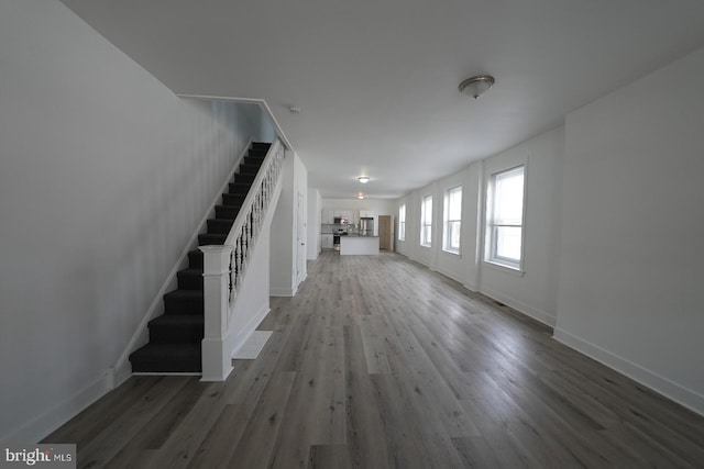 unfurnished living room with hardwood / wood-style floors