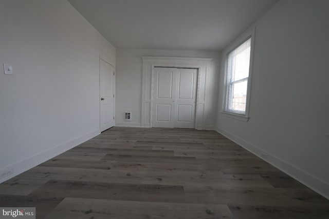 unfurnished bedroom featuring wood-type flooring