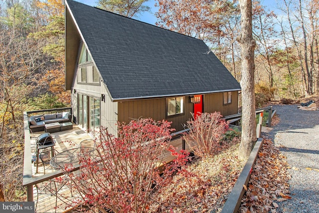 view of side of property featuring an outdoor living space