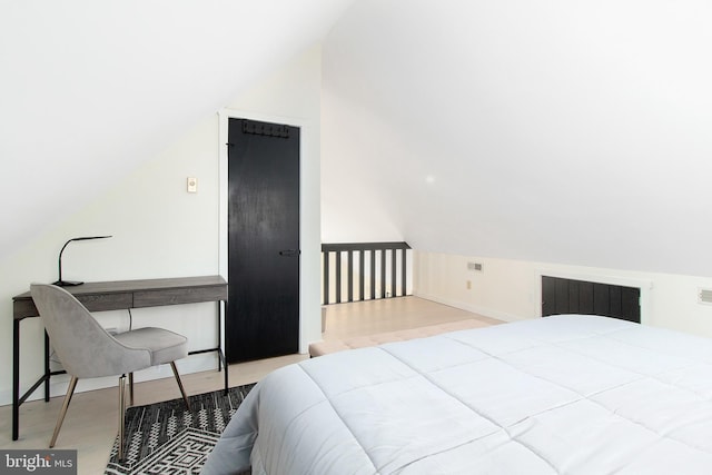 bedroom with vaulted ceiling