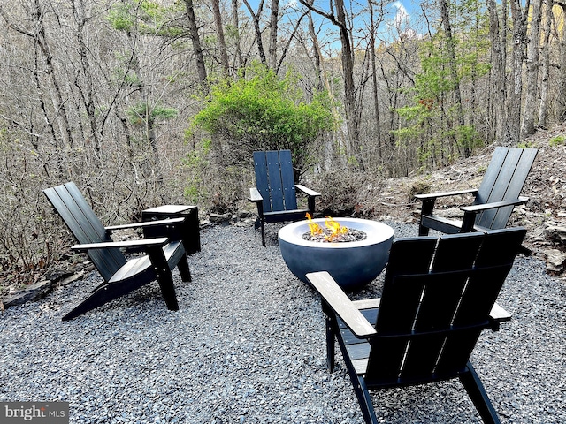 view of patio with an outdoor fire pit