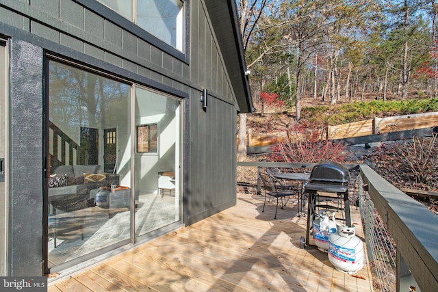 view of patio / terrace featuring a wooden deck and area for grilling