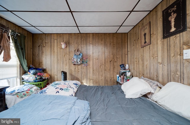 bedroom with wooden walls