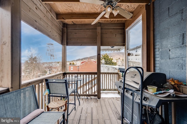 deck with a mountain view and ceiling fan