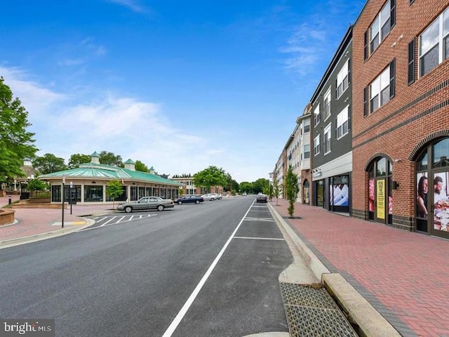 view of street with sidewalks and curbs