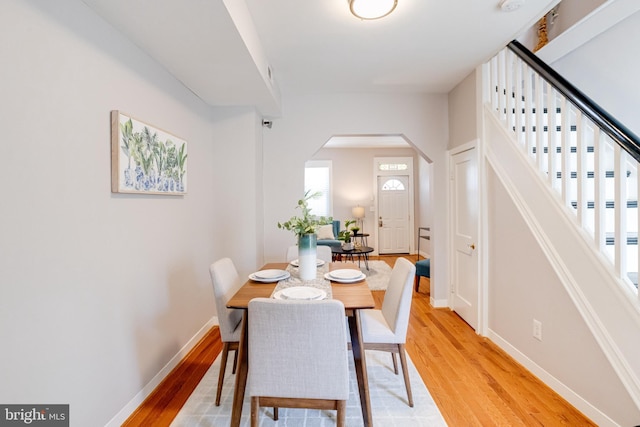 dining space featuring light wood-type flooring