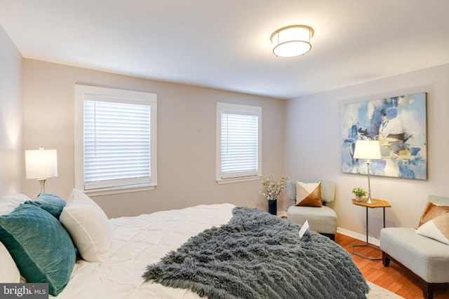 bedroom with hardwood / wood-style floors