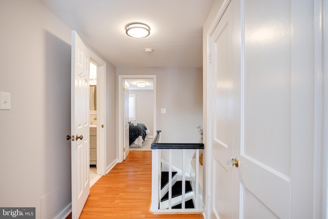 hall with light wood-type flooring