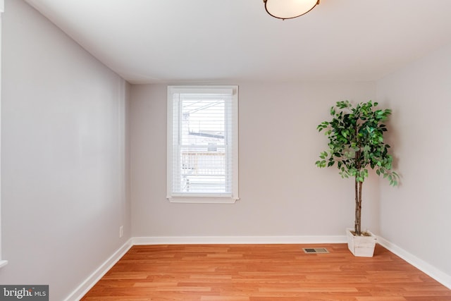 empty room with light hardwood / wood-style floors