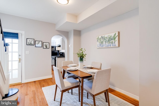 dining space with light hardwood / wood-style flooring