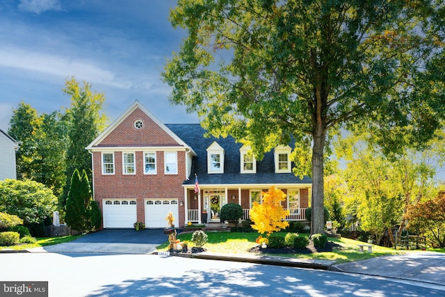 view of front of home featuring a garage and covered porch