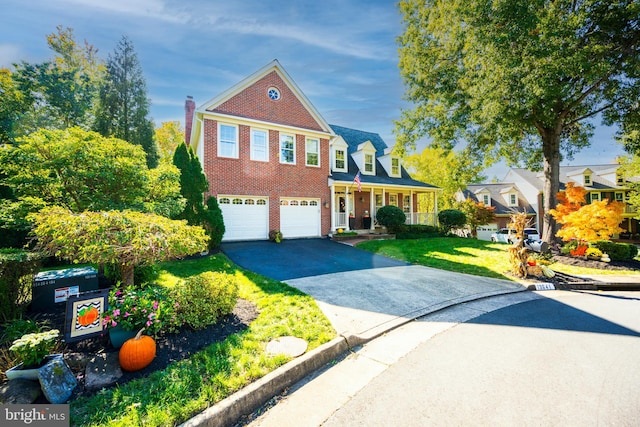 view of front of home with a garage and a front yard