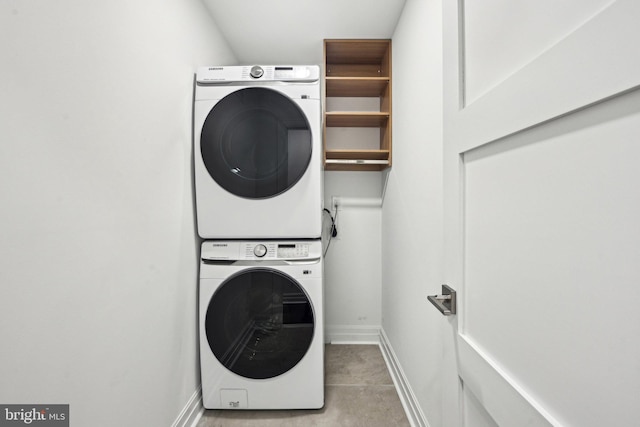 laundry area featuring stacked washer / dryer