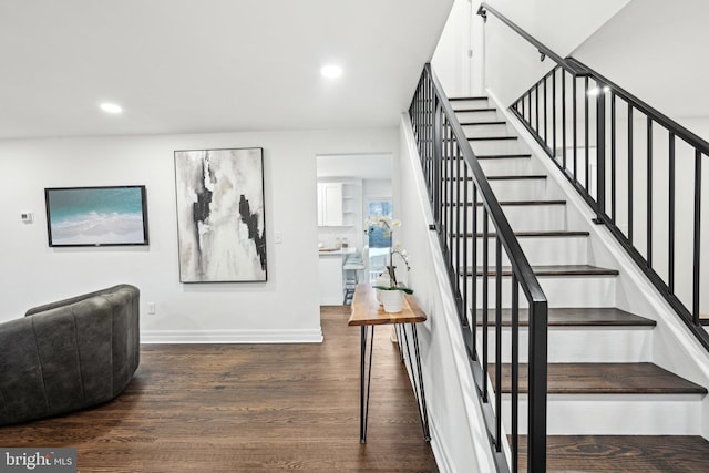 staircase featuring hardwood / wood-style floors