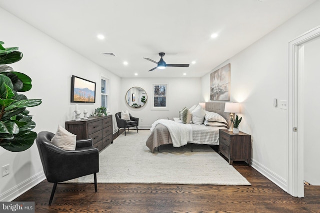 bedroom featuring ceiling fan and dark hardwood / wood-style flooring