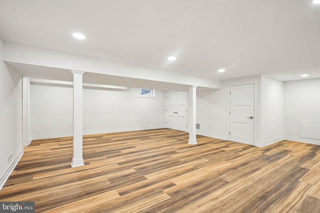 basement featuring wood-type flooring