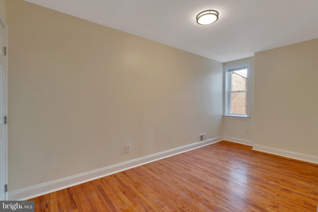 spare room featuring light hardwood / wood-style flooring