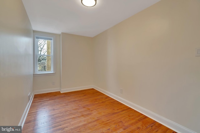 empty room with light hardwood / wood-style floors