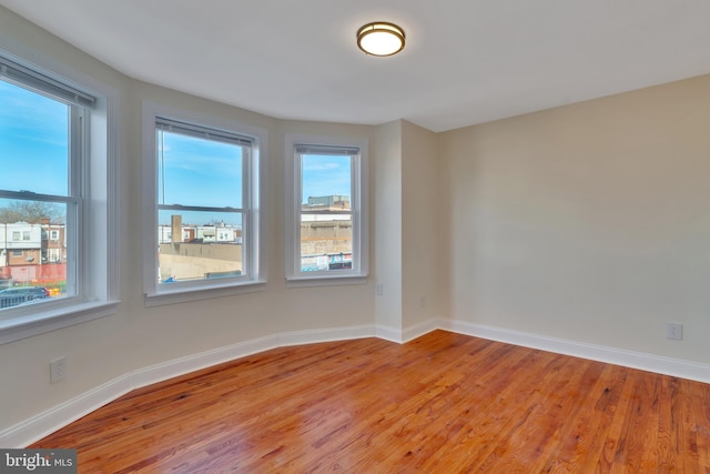 spare room featuring light hardwood / wood-style floors