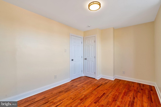 empty room featuring hardwood / wood-style flooring